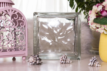 Deco glass block mockup on a table. Interior photography.