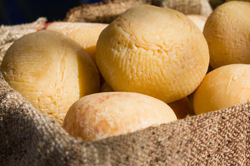 Cheese head in a basket closeup. Food