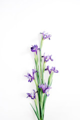 Obraz premium Beautiful purple iris flowers bouquet on white background. Flat lay, top view