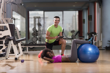 pilates workout with personal trainer at gym