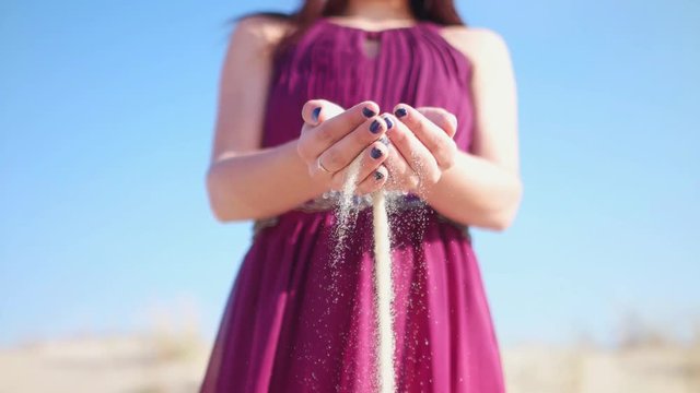 Sand leaking through the hands