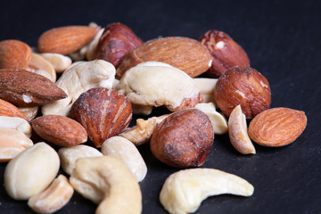 Nuts mix on black background. Close up