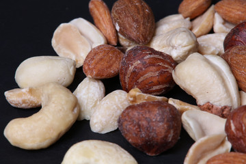 Nuts mix on black background. Close up