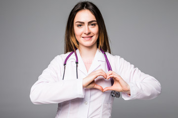 Doctor putting their hands in the shape of heart isolated on grey background