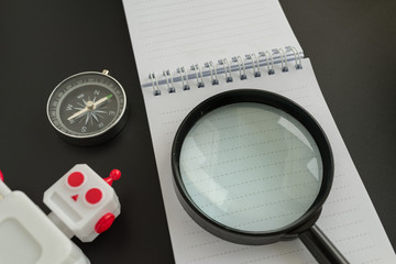 SEO search engine optimization website analysis concept with compass, robot and magnifying glass on note paper