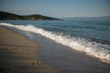 Beach view, waves, sand and blue sky
