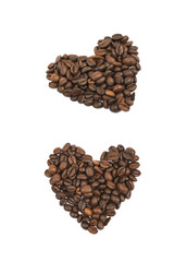 Heart shaped pile of coffee beans isolated