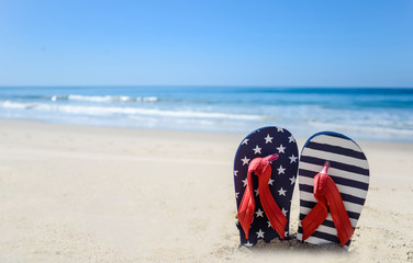 Naklejka premium Patriotic USA background on the sandy beach