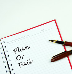 Communication message motivation concept with "Plan  or Fail " word on notebook.