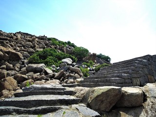 Old stone stairway steps in ruins of Gingee Fort (built on rocks) in Tamil Nadu.