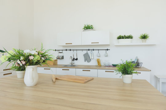 Bright kitchen background. The bright white kitchen. Wooden countertops