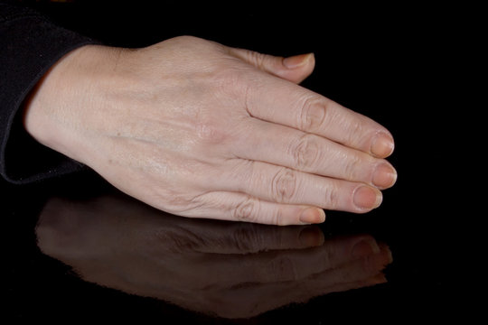 Female hand and its reflection