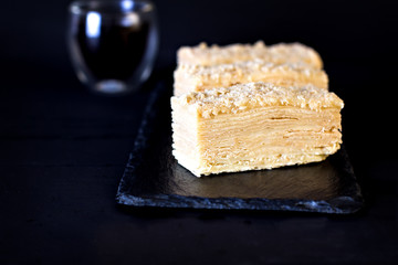 Napoleon cake on a dark background
