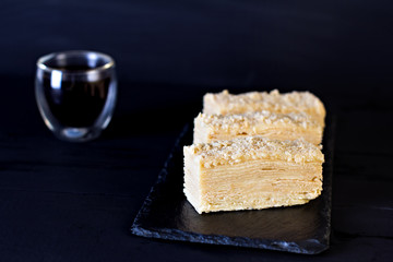 Napoleon cake on a dark background