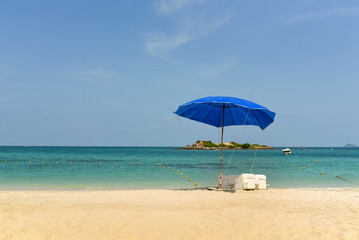 umbrella on beach sand and sea background