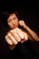 Portrait of woman practicing self defense.
