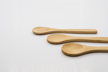 Wooden spoon over white background.