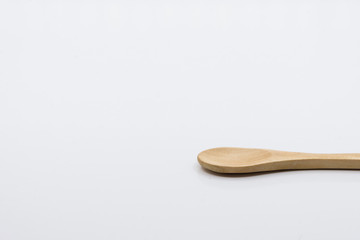 Wooden spoon over white background.