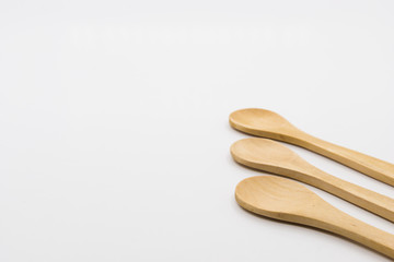Wooden spoon over white background.