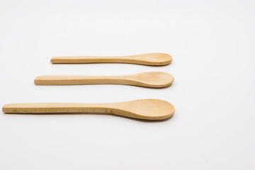 Wooden spoon over white background.