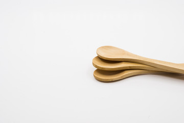 Wooden spoon over white background.