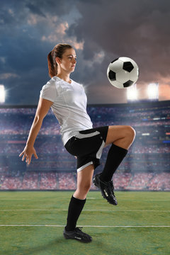 Female Soccer Player Dribbling Ball