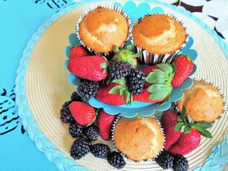Fresh baked muffins with blueberries and strawberries