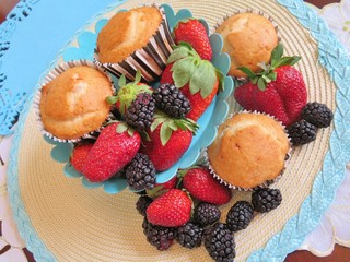 Fresh baked muffins with blueberries and strawberries