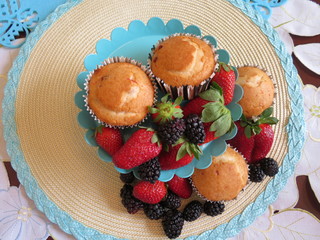 Fresh baked muffins with blueberries and strawberries