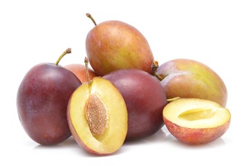 fresh plums on a white background