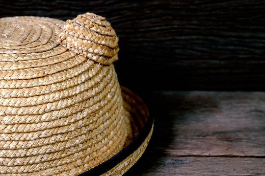 straw hat with wood background