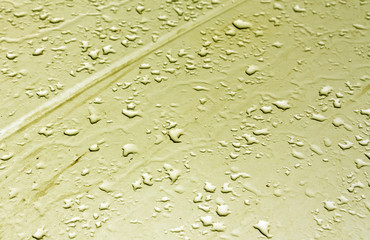 Water drops on metal surface with blur effect.