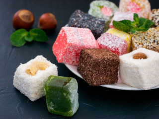 Turkish delight on black rustic background