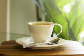 Iced coffee on wooden table