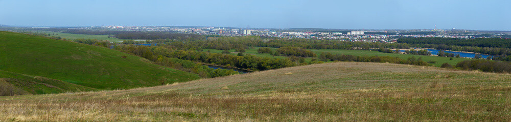 Naklejka premium Panoramic landscape. View from the hills to the city outskirts.