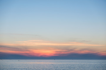 Naklejka na ściany i meble summer landscape beautiful bronze sunset over the sea