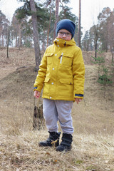 boy in a yellow jacket