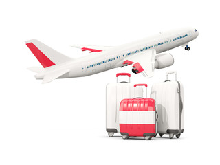 Luggage with flag of austria. Three bags with airplane