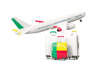 Luggage with flag of benin. Three bags with airplane