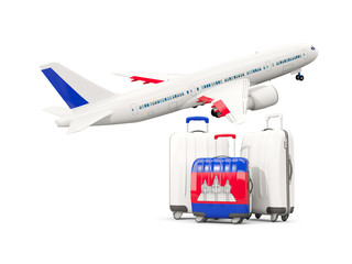 Luggage with flag of cambodia. Three bags with airplane