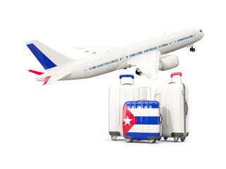 Luggage with flag of cuba. Three bags with airplane
