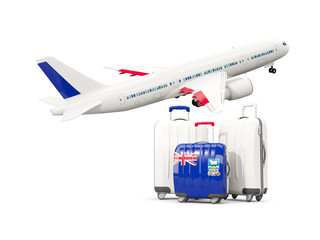 Luggage with flag of falkland islands. Three bags with airplane
