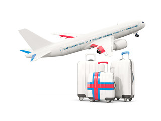 Luggage with flag of faroe islands. Three bags with airplane