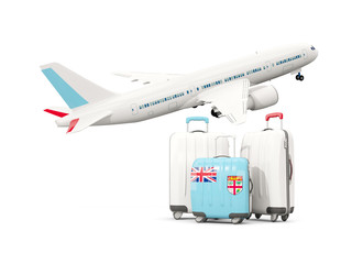 Luggage with flag of fiji. Three bags with airplane