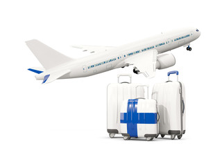 Luggage with flag of finland. Three bags with airplane