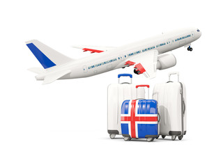 Luggage with flag of iceland. Three bags with airplane