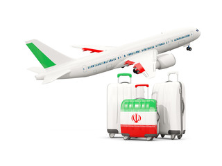 Luggage with flag of iran. Three bags with airplane