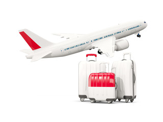 Luggage with flag of indonesia. Three bags with airplane