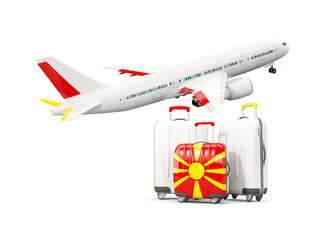 Luggage with flag of macedonia. Three bags with airplane