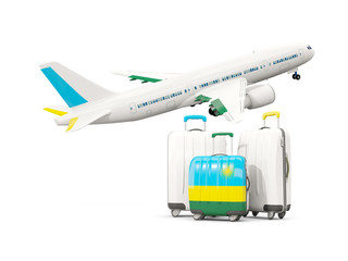 Luggage with flag of rwanda. Three bags with airplane